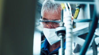 Man looking through glasses