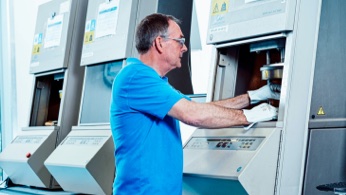 Man in blue shirt working